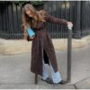 Model wearing a full-length suede trench coat in brown.