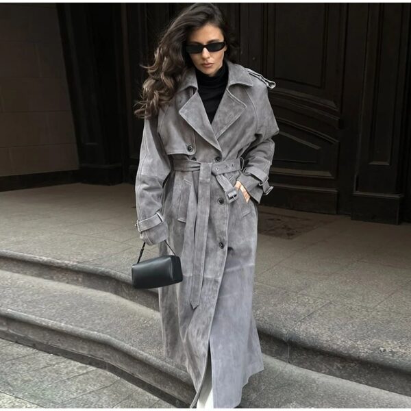 Model wearing a full-length suede trench coat in brown.