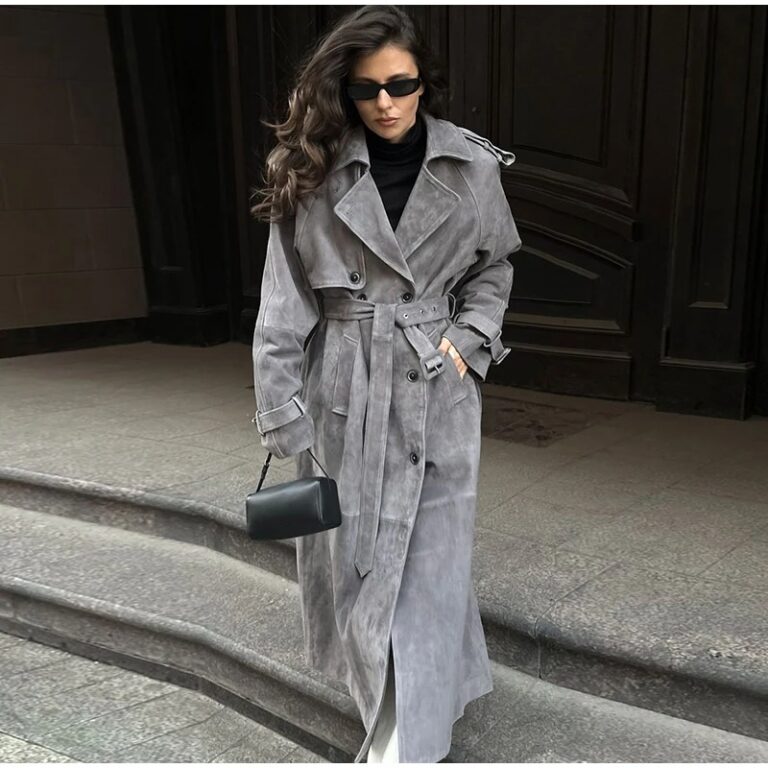 Model wearing a full-length suede trench coat in brown.