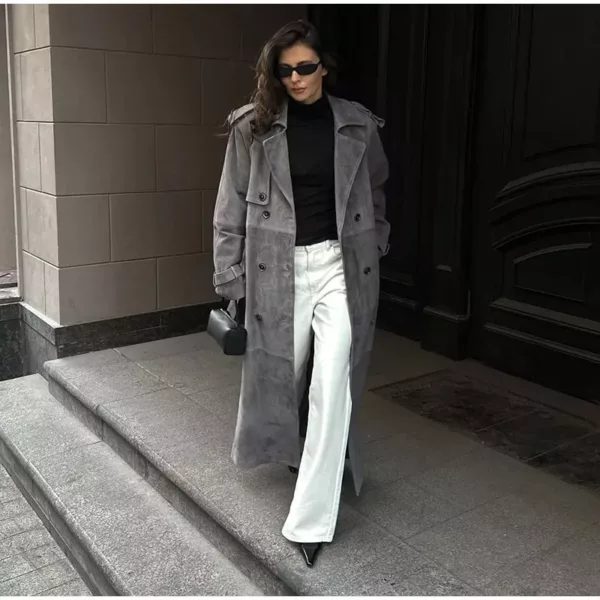 Model wearing a full-length suede trench coat in brown.