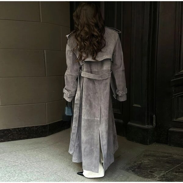 Model wearing a full-length suede trench coat in brown.