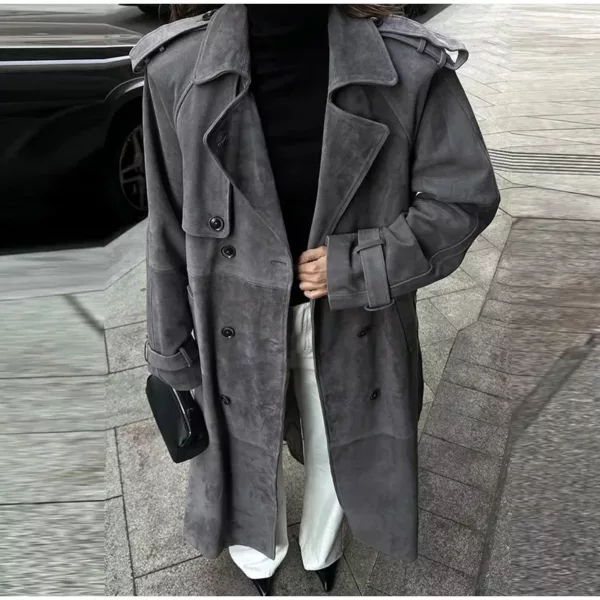 Model wearing a full-length suede trench coat in brown.