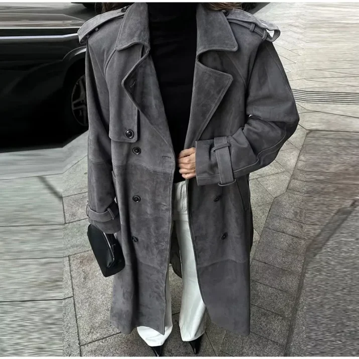 Model wearing a full-length suede trench coat in brown.