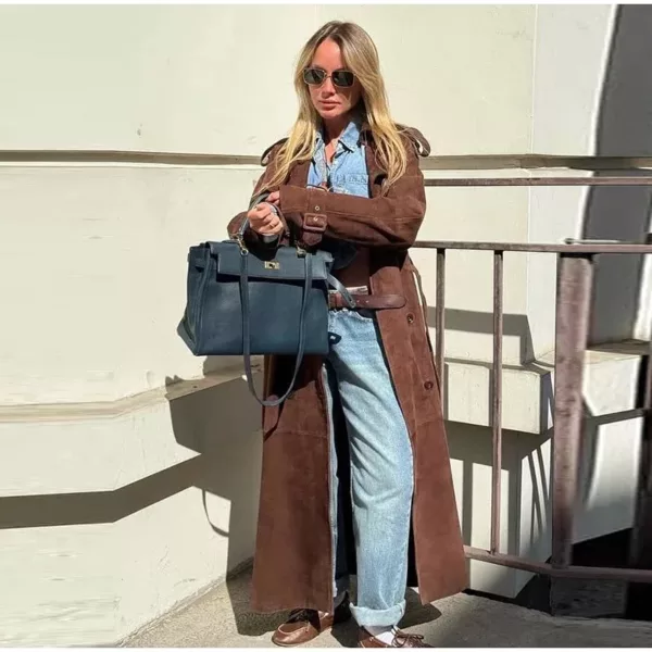 Model wearing a full-length suede trench coat in brown.