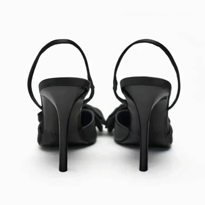 Black pointed-toe stiletto statement bow
