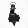Black pointed-toe stiletto statement bow