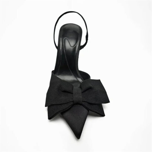 Black pointed-toe stiletto statement bow