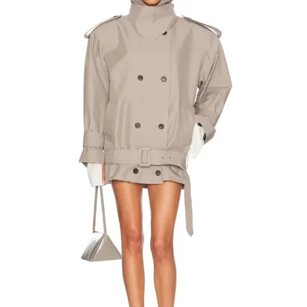 Model wearing an oversized trench coat with a wide lapel and belted hem.